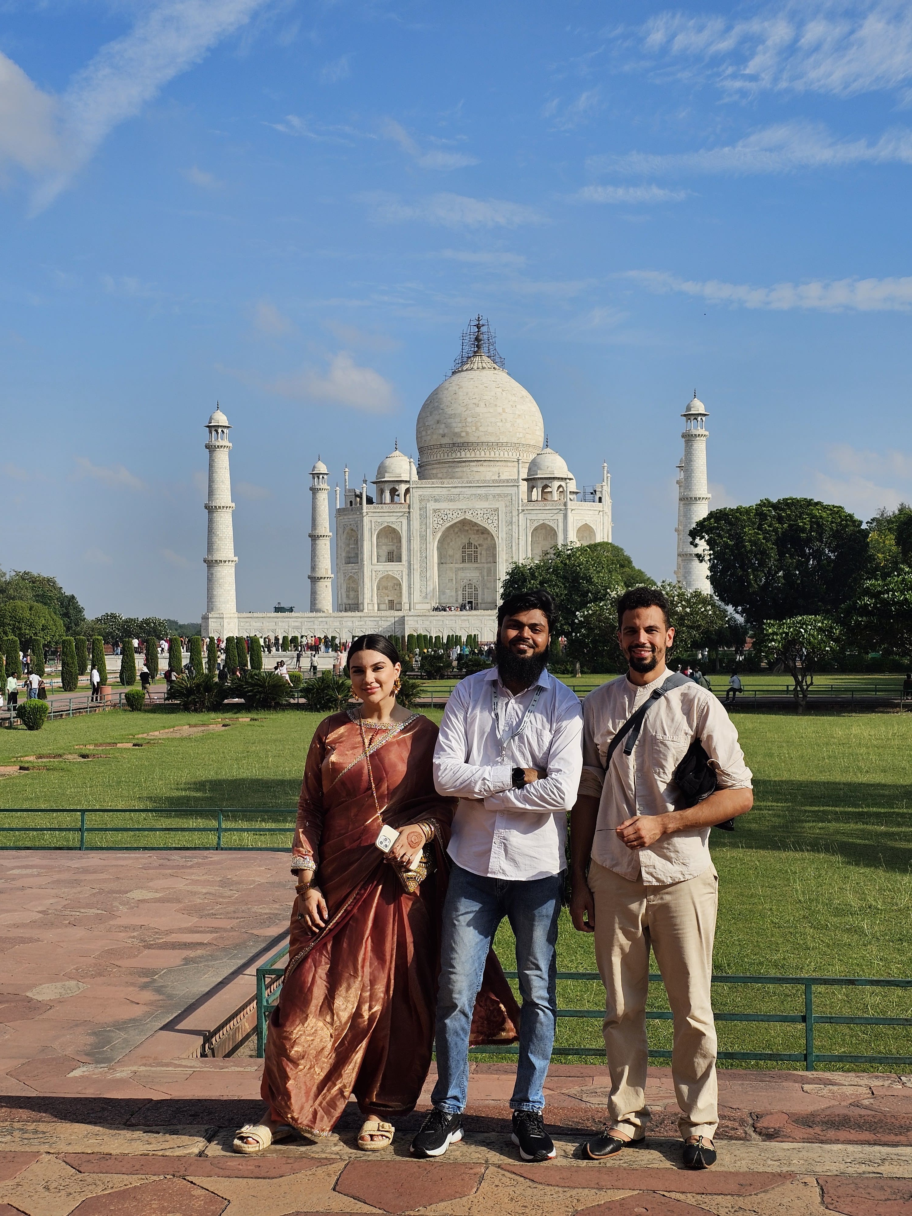 Latin American travellers taking photos at the Taj Mahal with licensed guide Kamran Khan