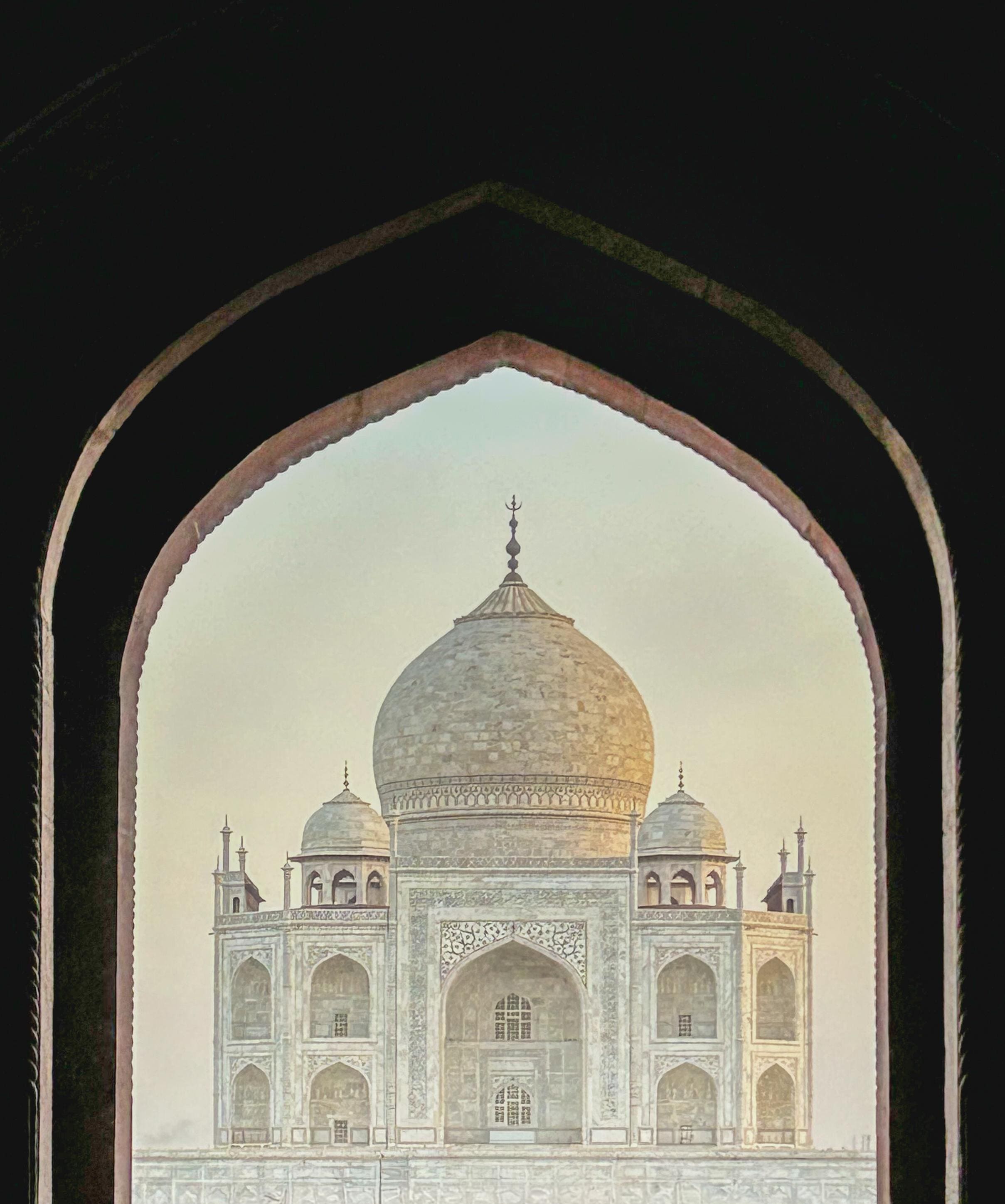 Beautiful interior view of the Taj Mahal through the royal entrance gate