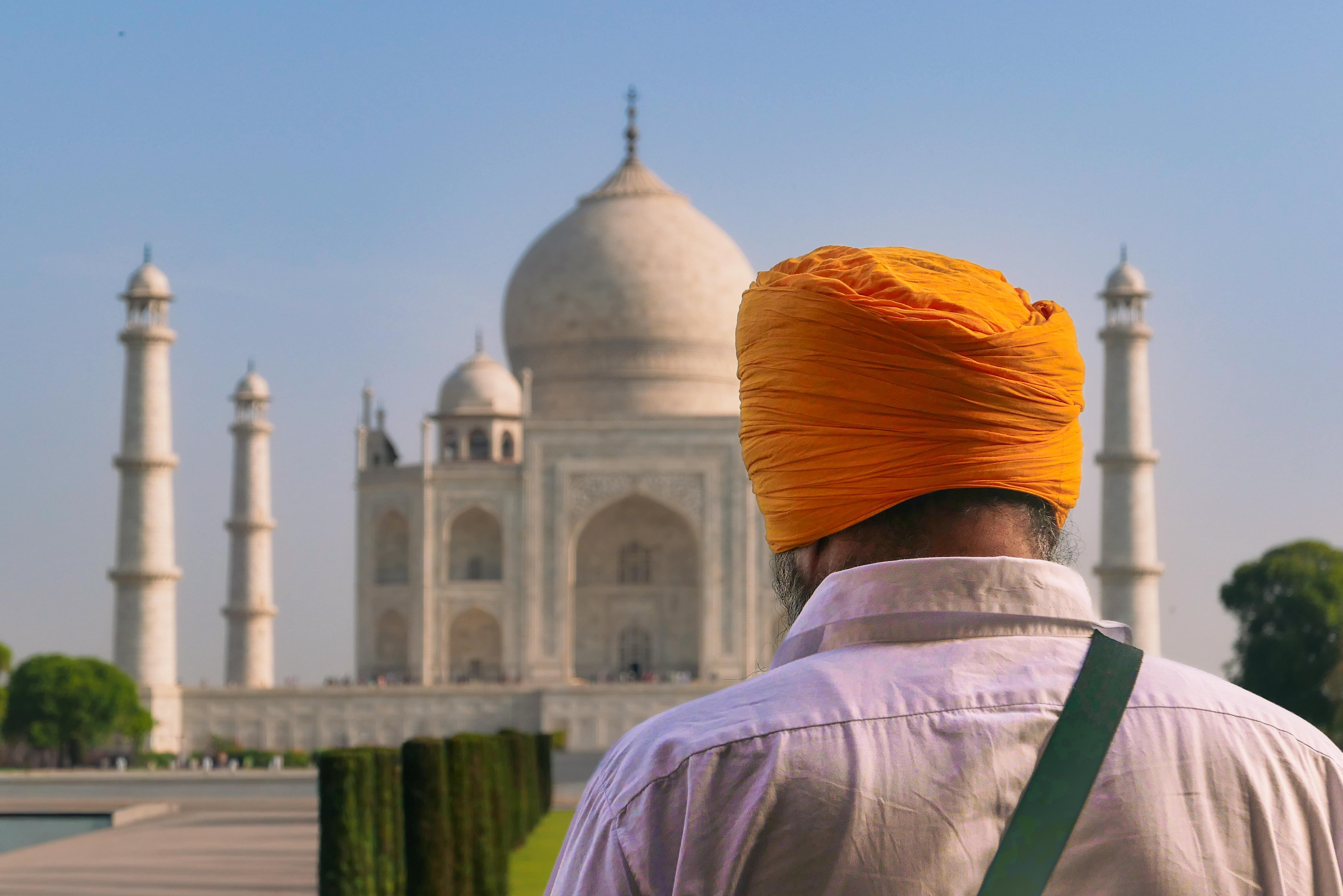 Traveller enjoying the beauty of the Taj Mahal during a guided visit